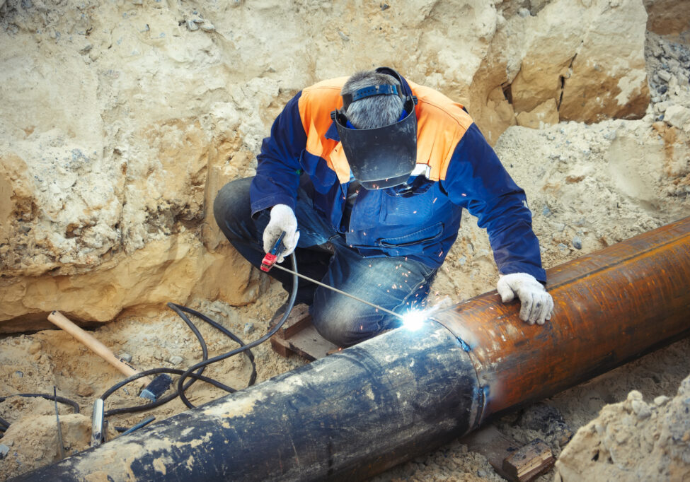 Welder Sydney Welding of the pipeline. Process of creation of welding connection by the special mobile tool.